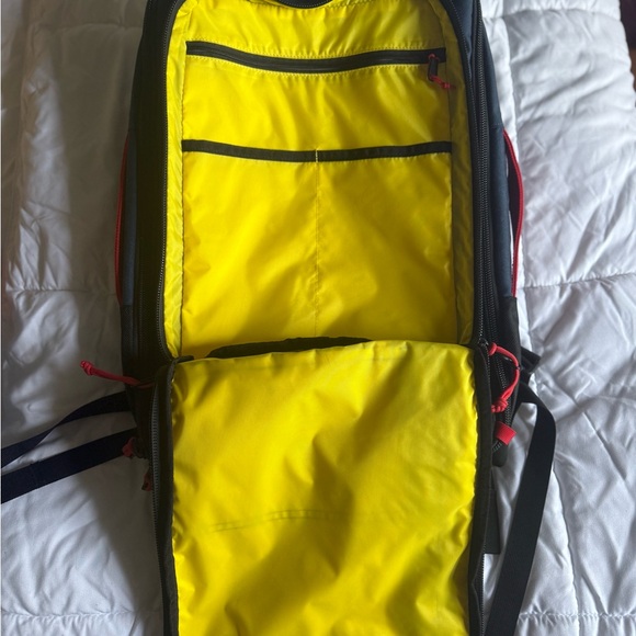 Topo Designs Backpack in Black, Red, and Yellow - Picture 2 of 10